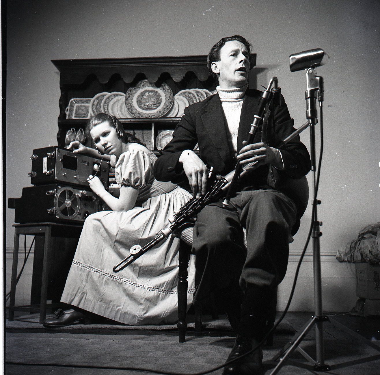 Photograph of Jean Ritchie recording Seamus Ennis playing the uilleann pipes, 1952, from Ritchie-Pickow Archive.